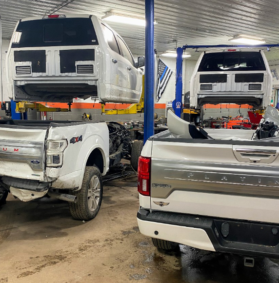 cars being worked on at shop